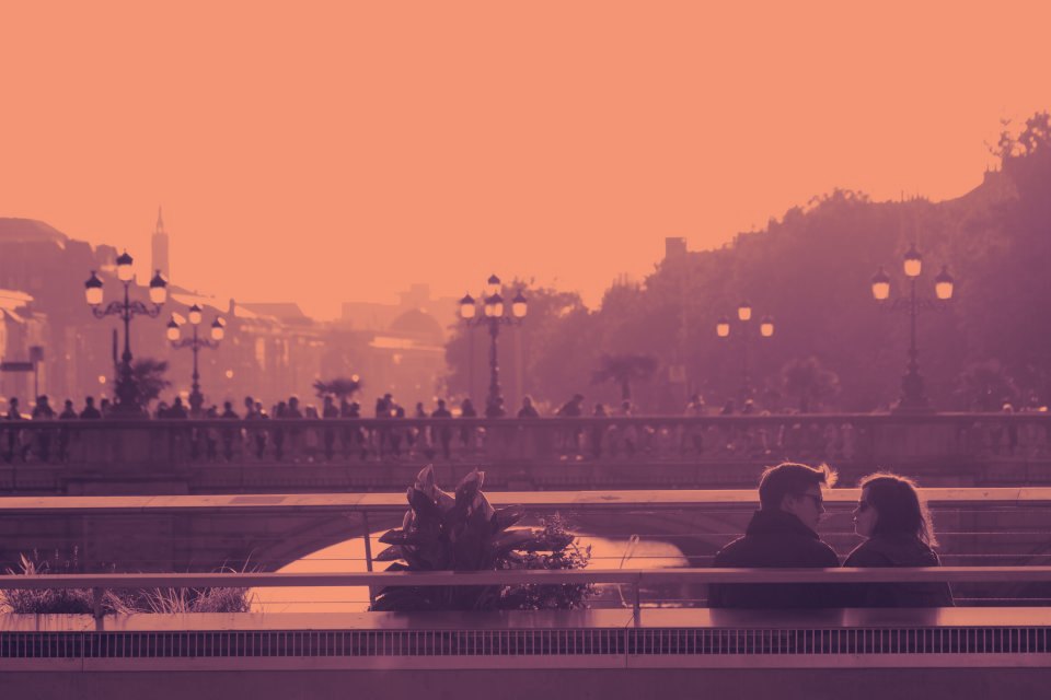 Two people in conversation at dusk